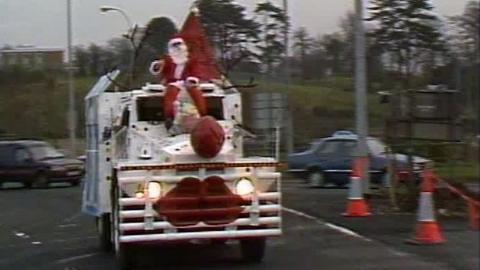 Santa sits on top of a a modified army Saracen