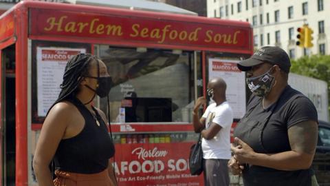 Reporter Alana Yzola (L) and Tami Treadwell, Harlem Seafood Soul