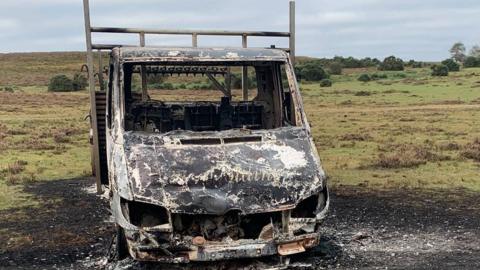 Burnt truck and calf