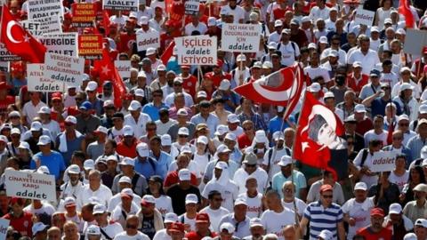 Supporters of Turkey's main opposition Republican People's Party (CHP) walk during the 22nd day of a protest