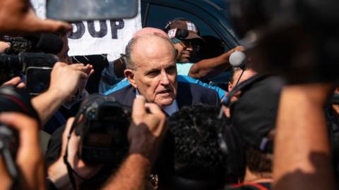 Rudy Giuliani speaks to the media after being booked at the Fulton County Jail on Wednesday, August 23, 2023