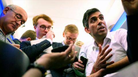 Prime Minister Rishi Sunak holds a press conference with political journalists on board a Government plane as he heads to Bali, in Indonesia to attend the G20 summit on 13 November 2022