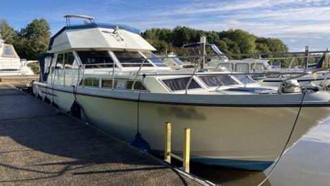 A boat docked in a marina. 