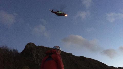 The three men were winched to safety by a coastguard helicopter