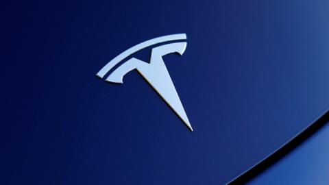 The front hood logo on a 2018 Tesla Model 3 electric vehicle is shown in this photo illustration taken in Cardiff, California, U.S., June 1, 2018.