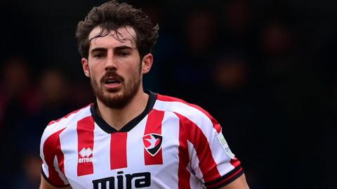 Sam Stubbs in action for Cheltenham Town