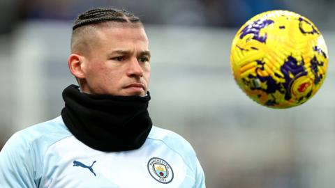 Kalvin Phillips looks at a ball during Manchester City training