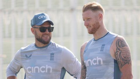 England coach Brendon McCullum (left) and captain Ben Stokes (right) talk in Pakistan during a training session