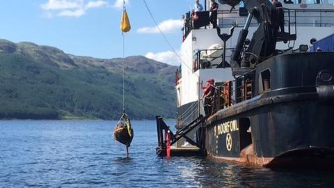 One of the bombs is lifted from the loch