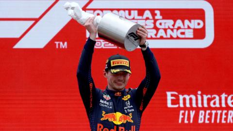 Max Verstappen holds the French Grand Prix winner's trophy aloft