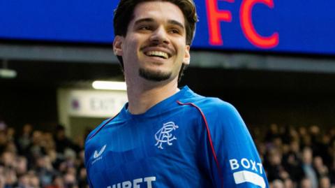 Ianis Hagis smiles after scoring for Rangers