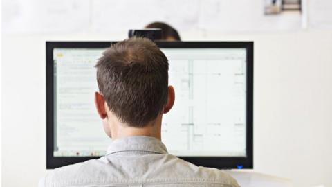 Man at a computer screen