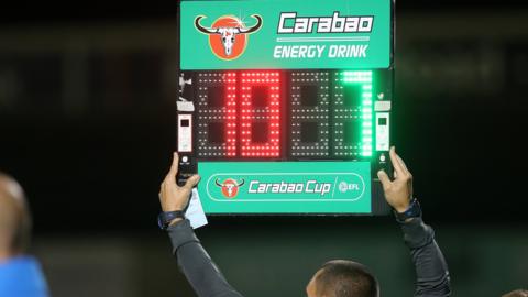 Substitutes board in an EFL Cup tie