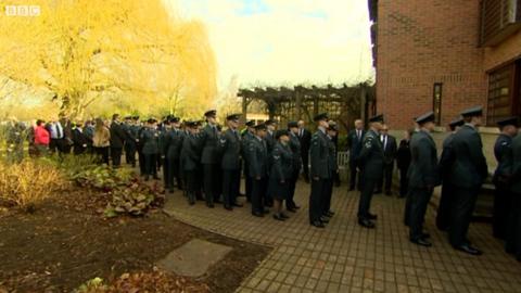 People lining up to attend funeral