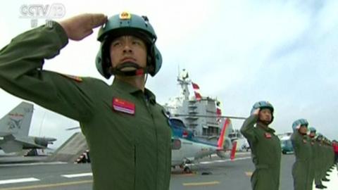 Troops salute at the Chinese naval parade