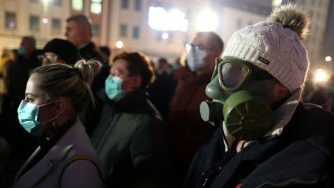 A demonstrator wears a gas mask during a protest over a lack of government action to tackle heavy air pollution in Tuzla, Bosnia and Herzegovina, 15 January 2020