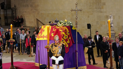 Members of the public file past the Queen's coffin at her lying-in-state at Westminster Hall on Sunday