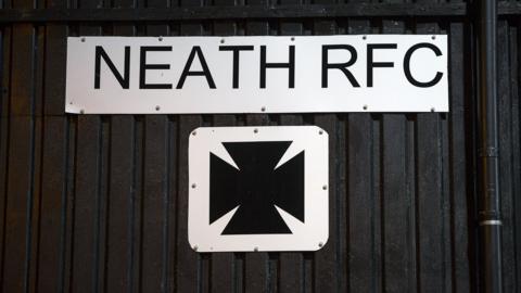 Neath RFC's sign and Maltese Cross emblem