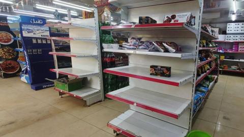 Empty shelves at a Khartoum grocery store