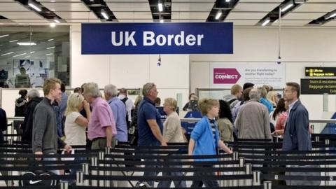 Passport checks at the UK border in Gatwick Airport