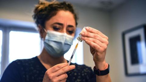 A French doctor prepares the AstraZeneca jab 25 February, 2021