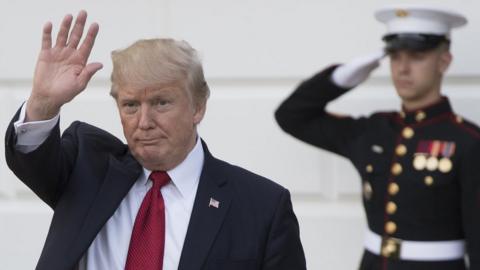 US President Donald Trump waves to the press after escorting Indian Prime Minister Narendra Modi to his car on the South Lawn of the White House in Washington, DC, June 26, 2017, following meetings and dinner.