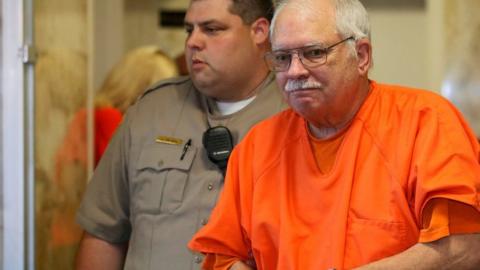 Robert Bates, a former Oklahoma volunteer sheriff's deputy, is escorted from the courtroom following his sentencing in Tulsa, Oklahoma, on 31 May