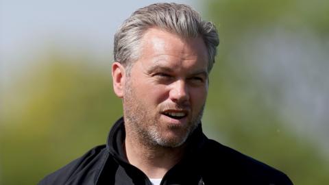 Daryl McMahon looks ahead in a black jacket