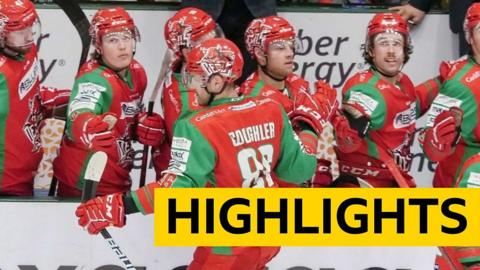 Jake Coughler celebrates scoring with the Cardiff Devils bench