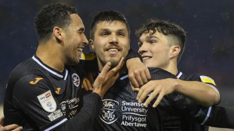 Ben Cabango, Joel Piroe and Kyle Joseph celebrate Swansea's winner
