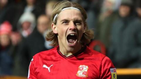 Ronan Darcy celebrates a goal for Swindon