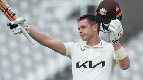 Jamie Smith celebrates scoring a century for Surrey against Middlesex