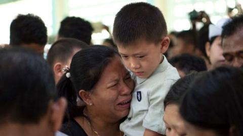 Relatives of Ne Win, who was shot dead outside Yangon airport while trying to stop the gunman who assassinated Ko Ni