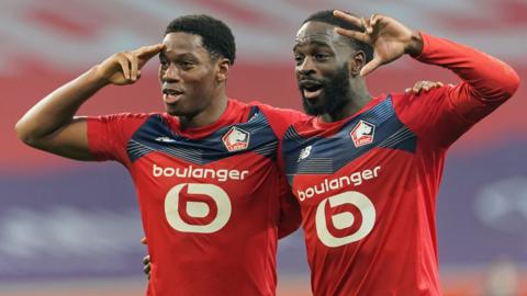 Lille's players celebrate after scoring against Marseille