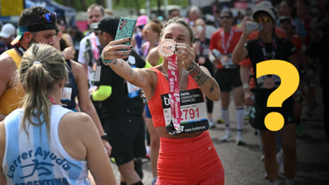 A woman takes a selfie after finishing the London Marathon