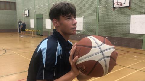 Arsenii Handzii playing basketball