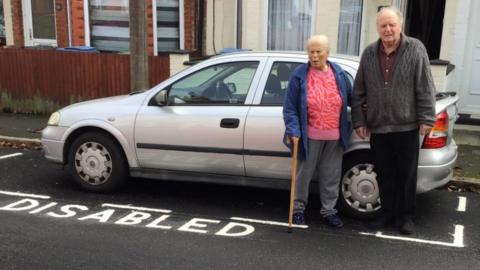 Maria and Brian Bishop by their disabled bay