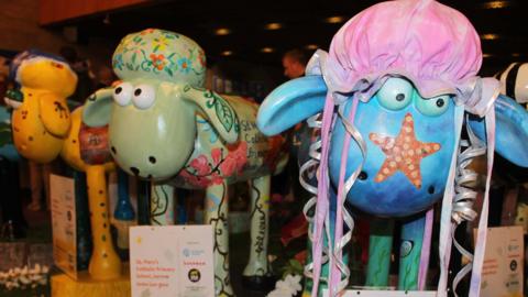 Three decorated models of Shaun the Sheep