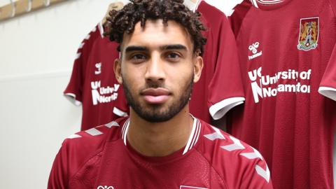 Kion Etete poses in a Northampton shirt