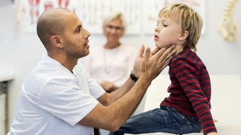 doctor examining a child