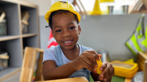 Girl at nursery building