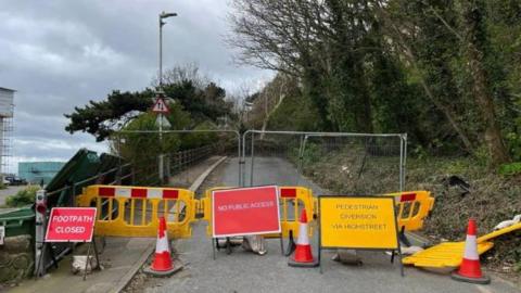 Signs showing the closure at Folkestone's Road of Remembrance