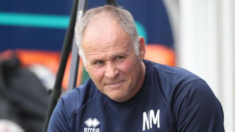 Neil McDonald during his spell at Hartlepool, with NM on his tracksuit