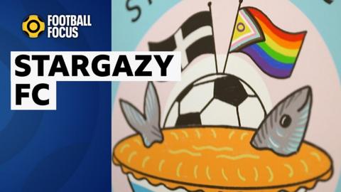 Stargazy FC's emblem - a 'Stargazy' fish pie, with Cornish and LGBT+ flags