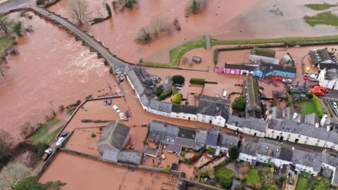 Roads and gardens in Crickhowell, Powys, were turned into lakes, after the river burst its banks