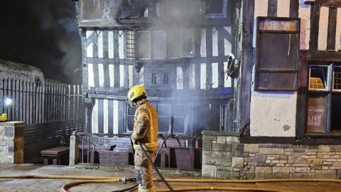 Firefighter by the smoking pub