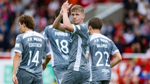 Dundee United's Zac Sapsford celebrates