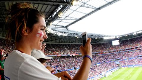 England fan takes picture of packed stadium