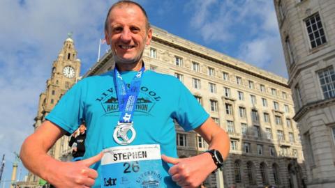 Stephen Symons poses in Liverpool post race