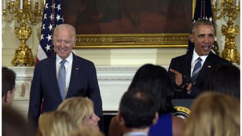 President Barack Obama honors Vice President Joe Biden during a ceremony in the State Dining Room of the White House in Washington